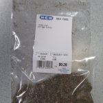Small bag of dried leaf thyme showing price per pound and cost of the amount purchased