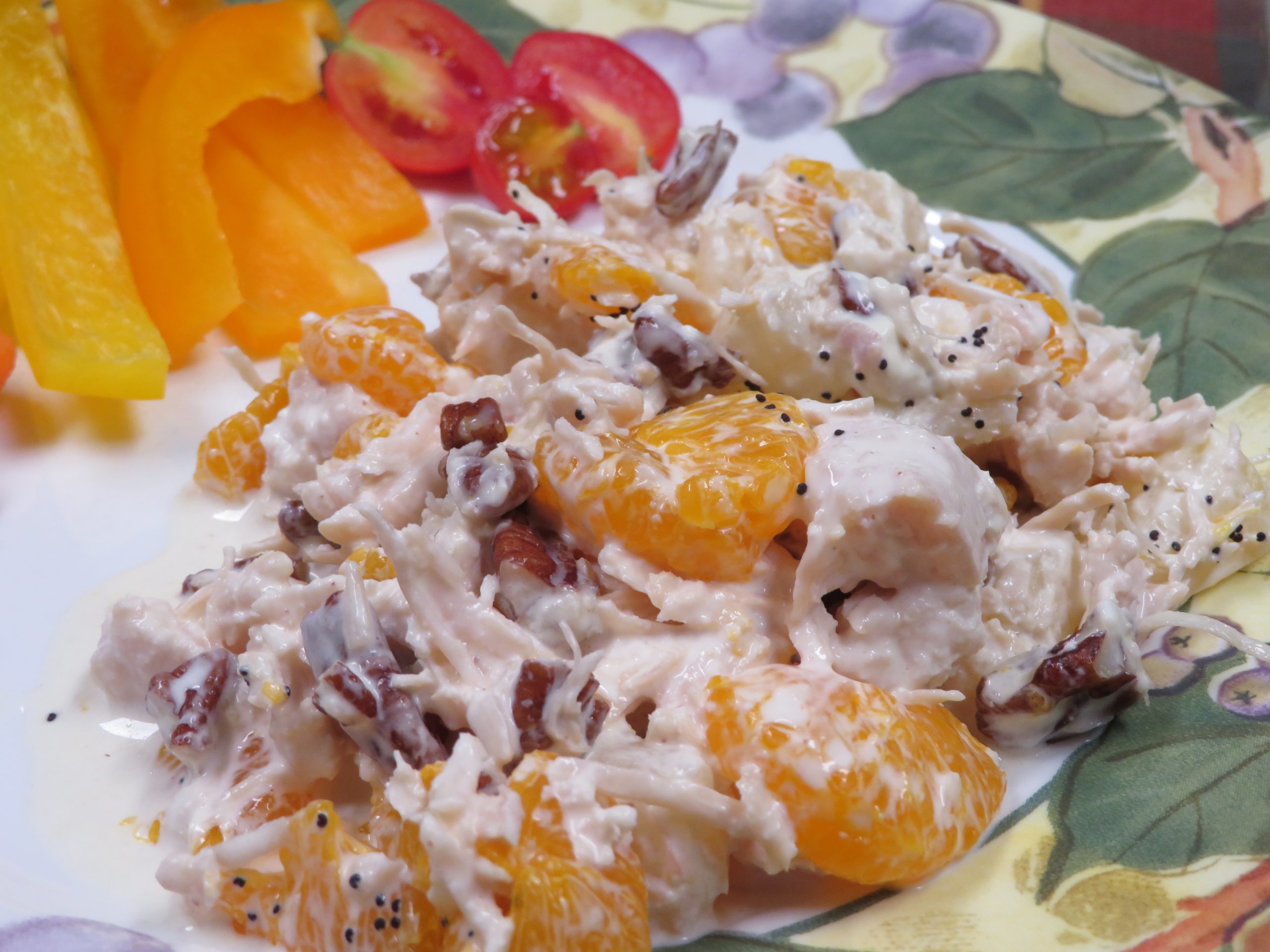 Fruited Chicken Salad on a plate with raw vegetables