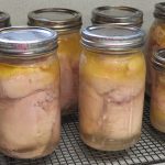 Quart and pint jars of bone in chicken thighs
