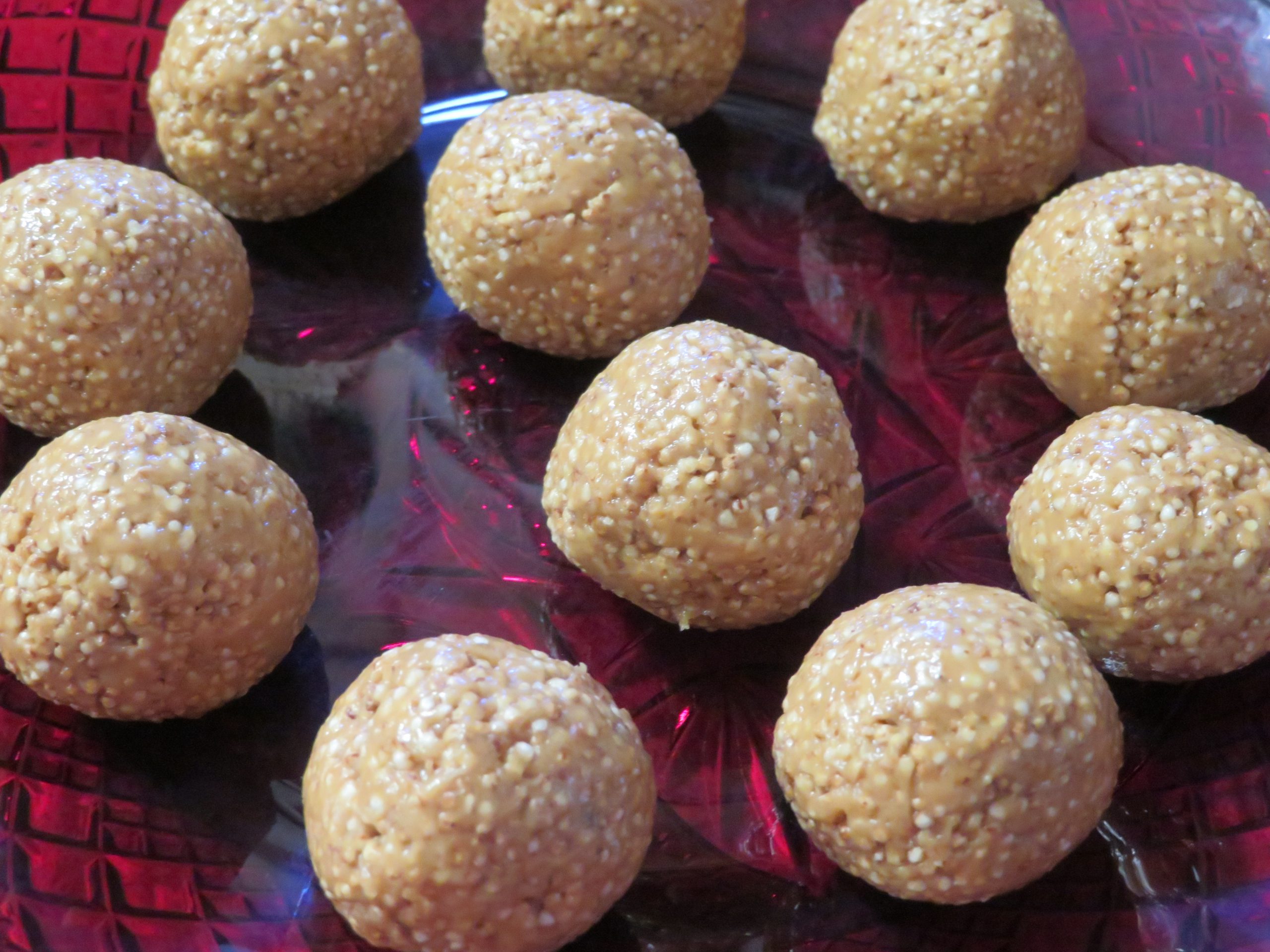 Amaranth Peanut Butter Balls on a red plate