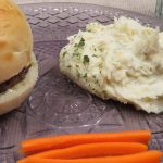 Mashed Potato Salad on a plate with a hamburger and carrot sticks