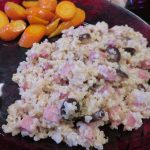 Quinoa and Ham Salad with Ranch dressing and olives on a plate