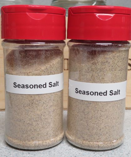 Two spice jars of seasoned salt