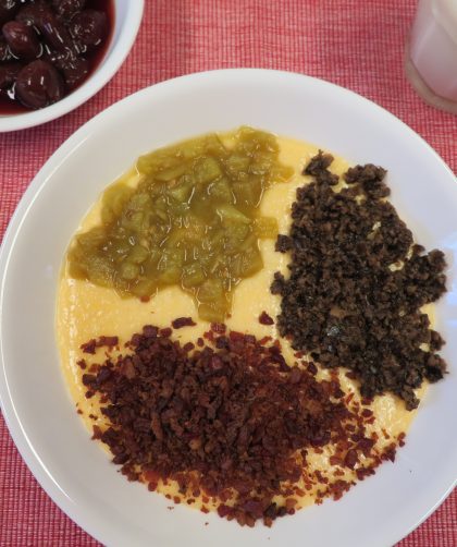 Cheese Grits Bowl with green chiles, chopped black olives, and crumbled bacon