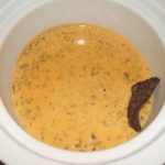 Green Chile Queso in a small slow cooker