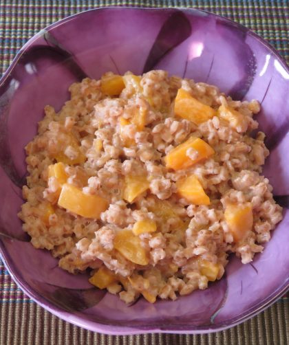 Peaches and Barley cereal in a purple bowl