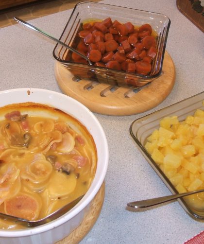 Home storage dinner of ham and potato casserole, brown sugar carrots, and pineapple tidbits