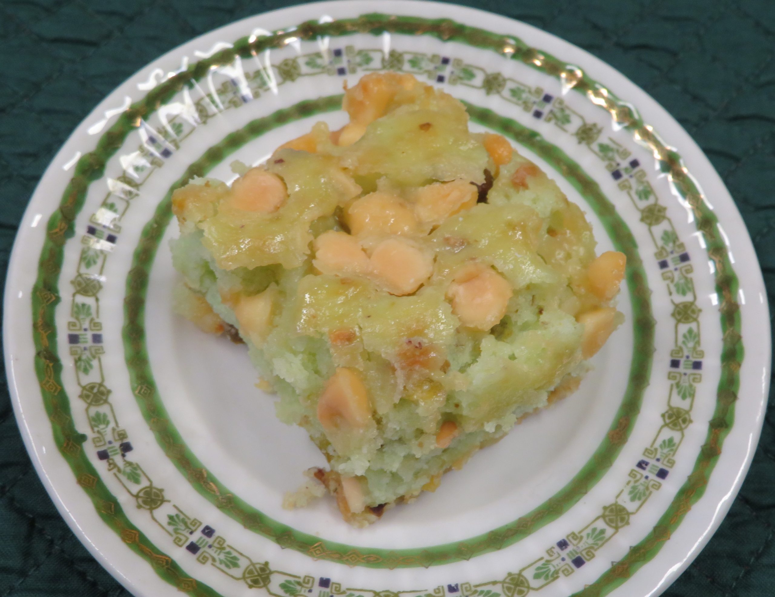 White Chocolate Pistachio Bars on a green edged plate